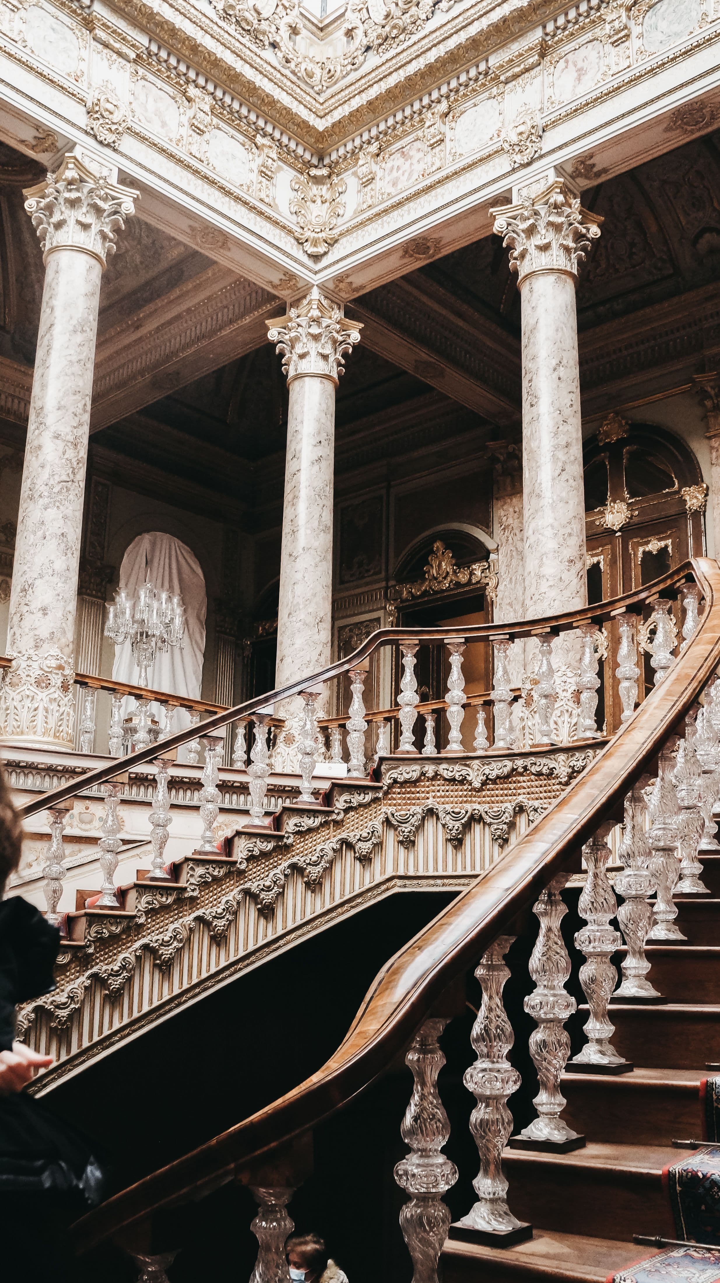 Ornate staircase with crystal balusters and gilded columns