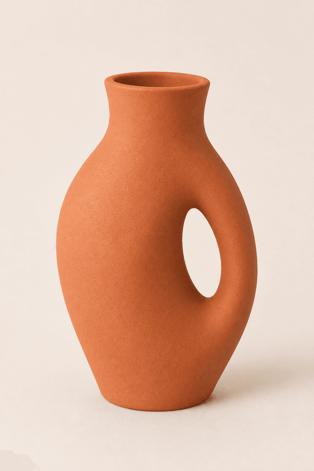 Terracotta vase with a sculptural looped handle
